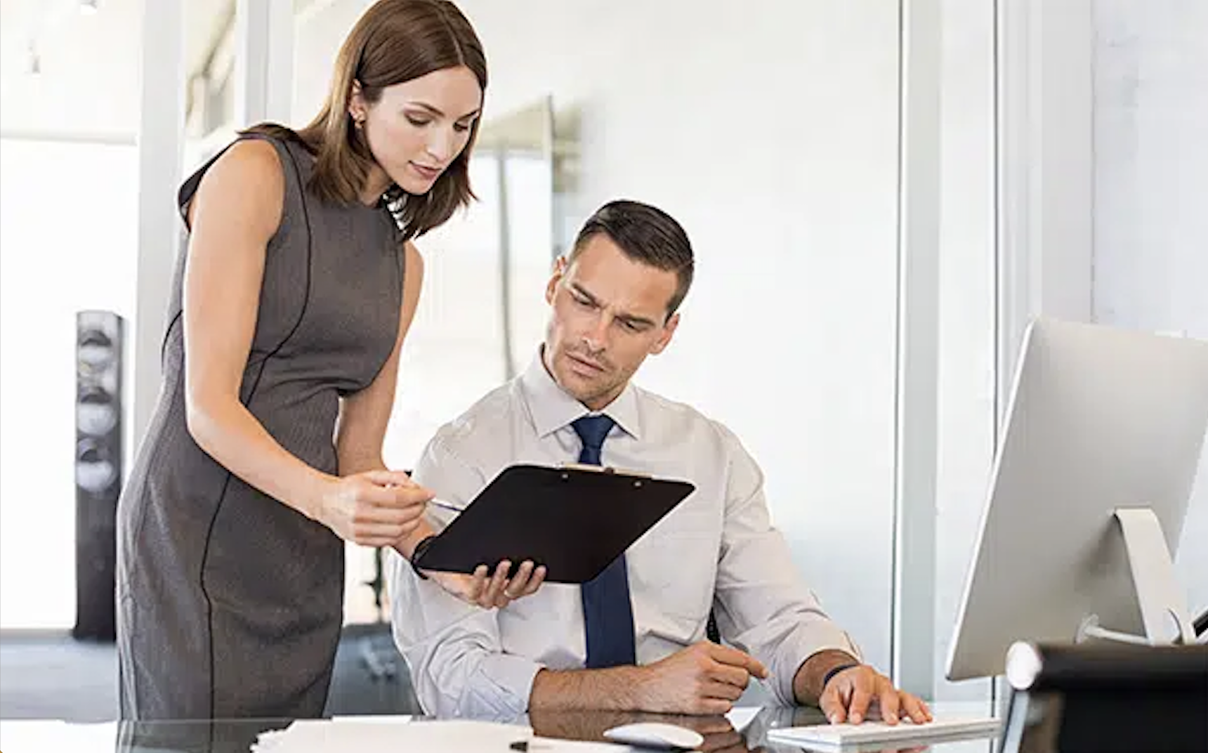 female and male recruiting team looking at report in charlotte nc office